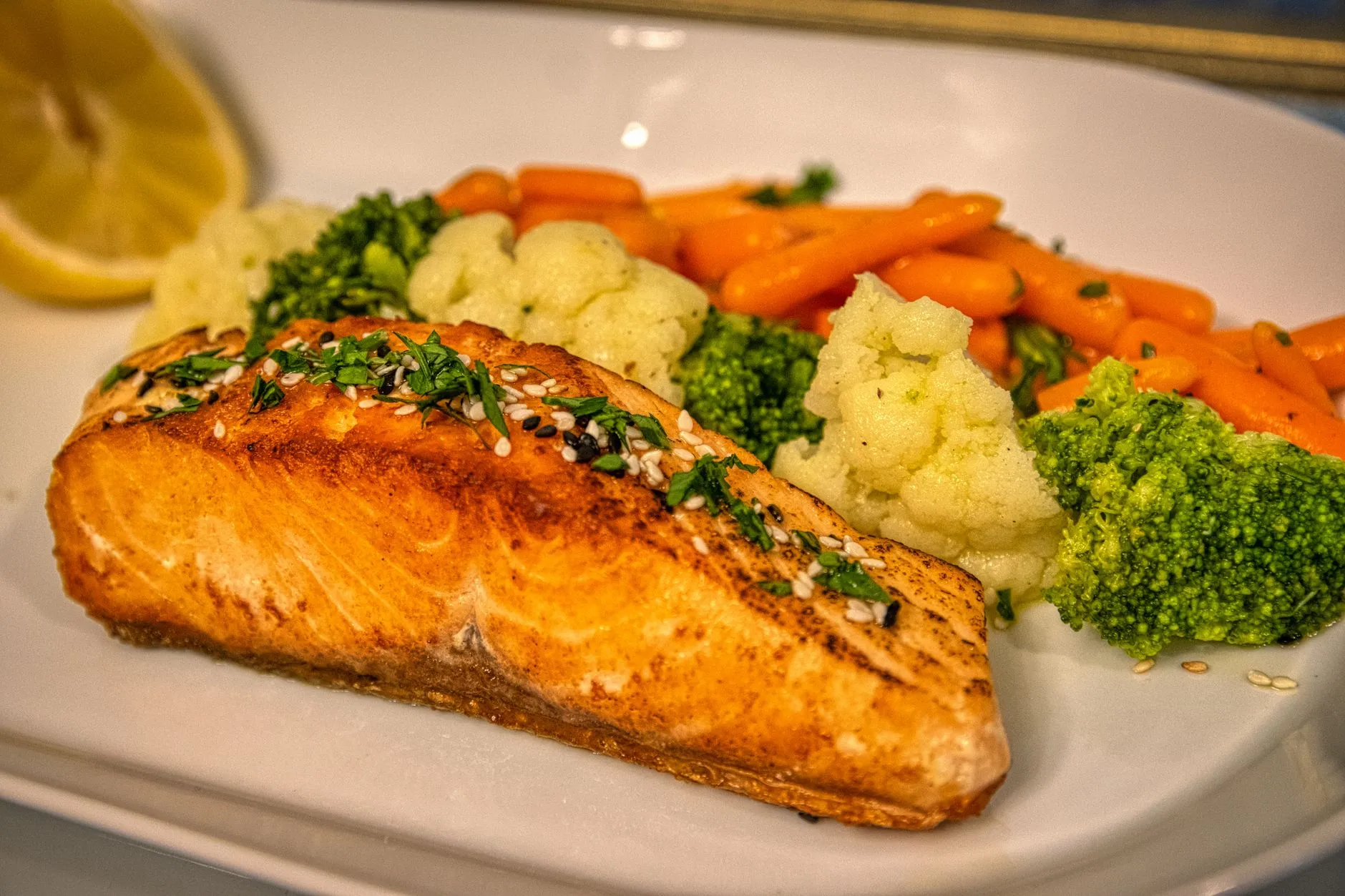A plate of salmon and vegetables