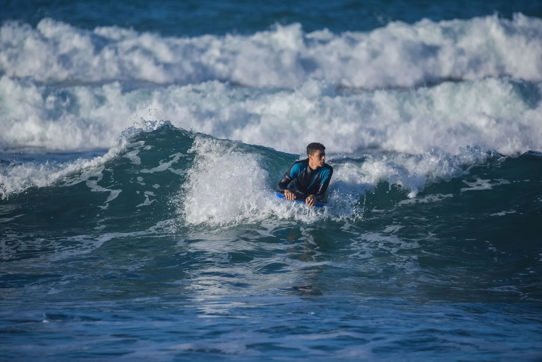 A surfer riding a wave